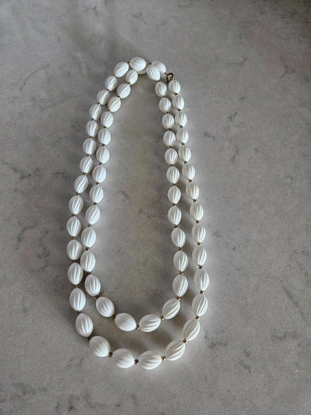 RARE AND VINTAGE WHITE RIBBED OVAL BEAD 48